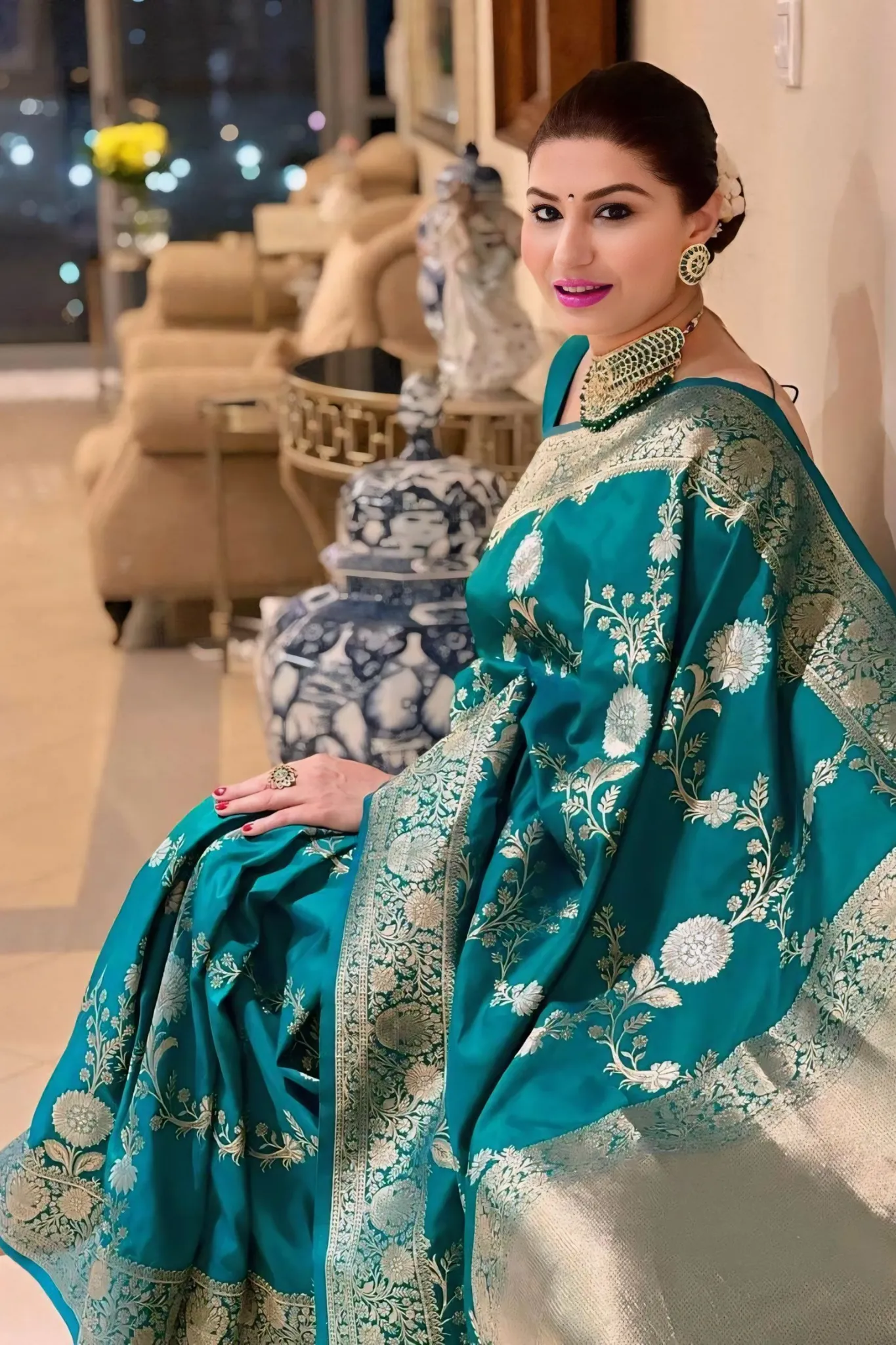 A REGAL BANAEASI SILK SAREE WITH INTRICATE GOLDEN ZARI WORK